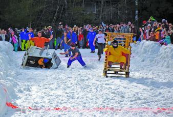 Lance Black, piloting the Poop Coop and his team of Luke Black, Chris Alexander and Jack Alexander, successfully slid to victory in the 14th annual Outhouse Races held Saturday, Feb. 15 at the Sapphire Valley Resort.