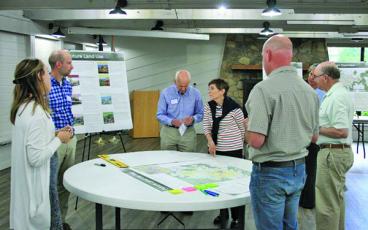 Photo by Ryan Hanchett/Staff Representatives from Stewart Inc. and town staff discussed several facets of the plan at a meeting last year. 