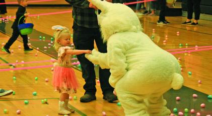 Children donned their Easter best and raced through the Highlands Rec Center gym as part of the “Easter Egg Scramble” on Saturday. Cold temperatures and steady rain forced the annual town Easter Egg Hunt indoors.