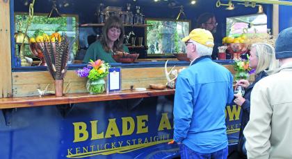 Guests of the Highlands Food and Wine Festival visit the Blade and Bow drink station on Friday afternoon.