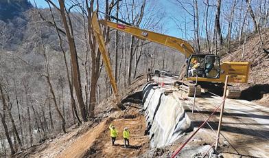 Submitted photo - Crews work to fix the washed out section of Highlands Road on Monday, Jan. 29.