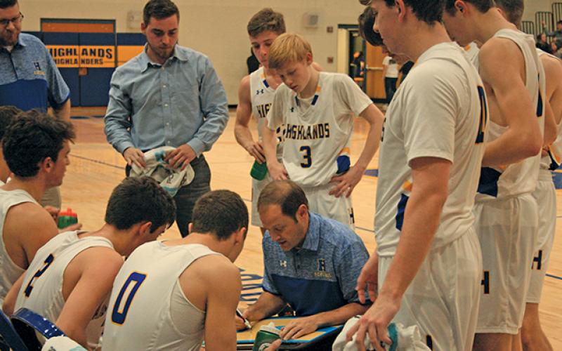 Highlands coach Brett Lamb draws up a play during a timeout against Murphy on Friday night.