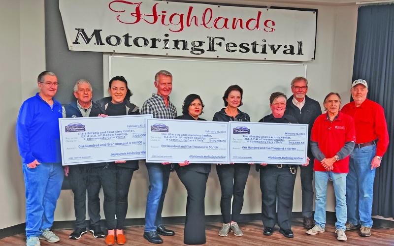The Highlands Motoring Festival raised $105,000 in 2023, which has been split evenly among three area nonprofits. Pictured are Lester Norris, Steve Ham, Bonnie Potts, David Moore, Faviola Olvera, Cindy Trevathan, Chief Andrea Holland, Mayor Pat Taylor, Ricky Siegel, and Steve Mehder.
