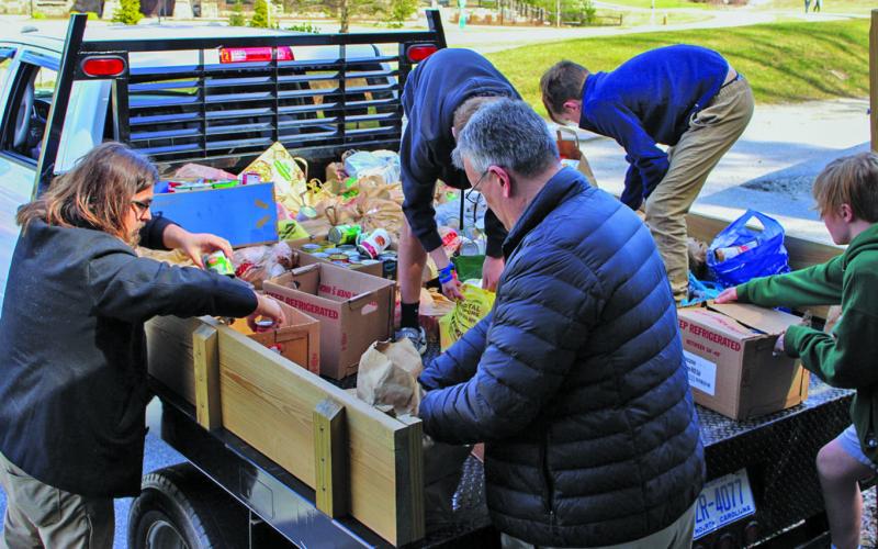 Students and volunteers from Summit Charter School delivered more than 3,000 food items to Fishes and Loaves Food Pantry in Cashiers following a food drive at the school. The middle school student council organized the food drive.