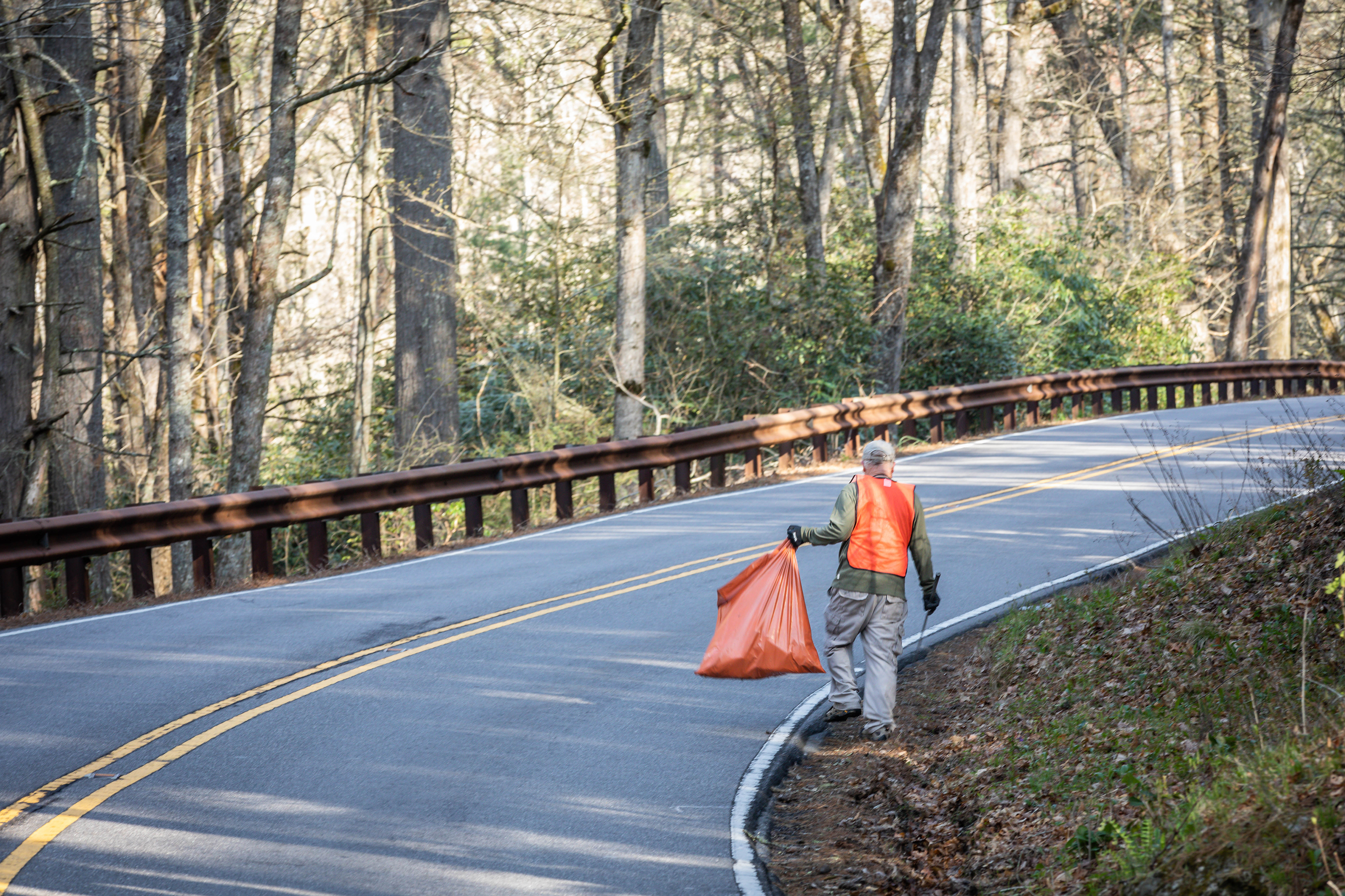 Submitted photo  A volunteer walks a stretch of road during the pickup. 