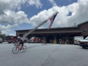 Carolina Brotherhood bikers take off from Highlands Fire and Rescue en route to Franklin on their Thursday route encompassing 65.6 miles. Photo by Mitch Stone