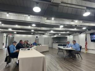 The town board listens to McGill Associates’ presentation on the Mirror Lake dredging project during the July 16 board meeting.