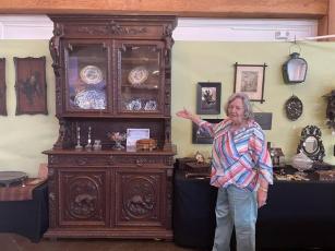 Hazel Giles, who has her own booth at the Cashiers Annual Antique Show, displays a selection of Black Forest carvings that originated in 19th-century Switzerland.
