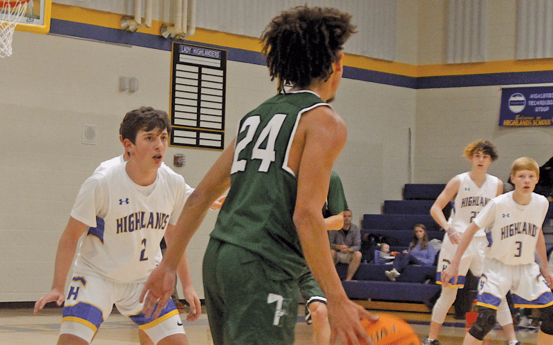 Highlands players do their best to play team defense against Tallulah Falls on Monday night.