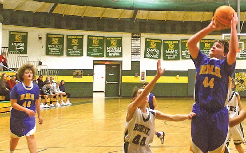 Highlands’ Sam Stiwinter (44) goes up for a basket during the first half against Blue Ridge on Thursday, Nov. 21.