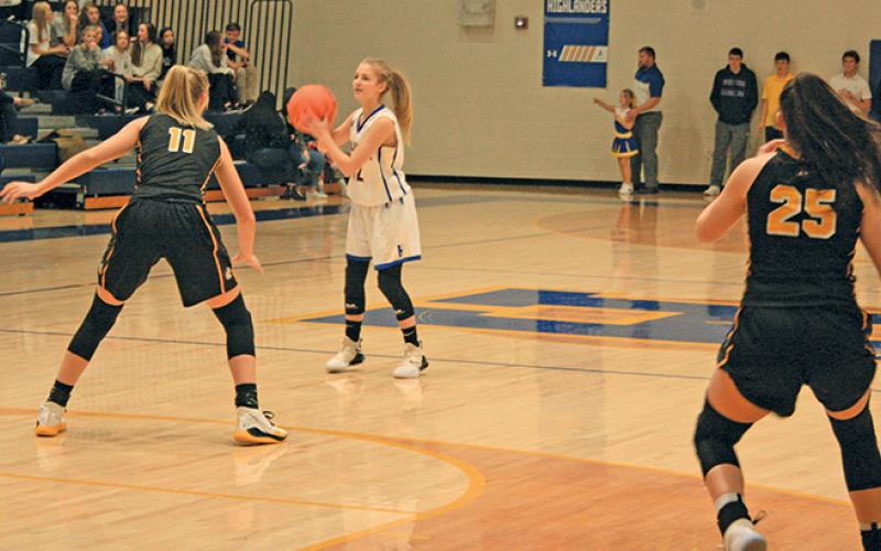 Highlands guard Hayley Borino surveys the defense against Murphy.