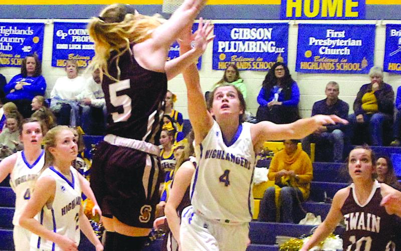 Julia May Schmitt (4) cuts to block off Ashton Yonce (5) of Swain County.