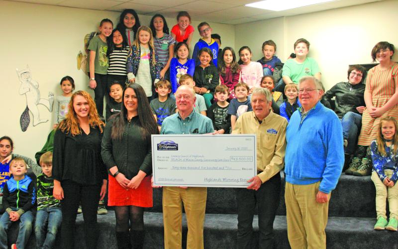 Representatives from the Highlands Motoring Festival visited The Literacy Council on Thursday to present donations to three local nonprofit organizations.