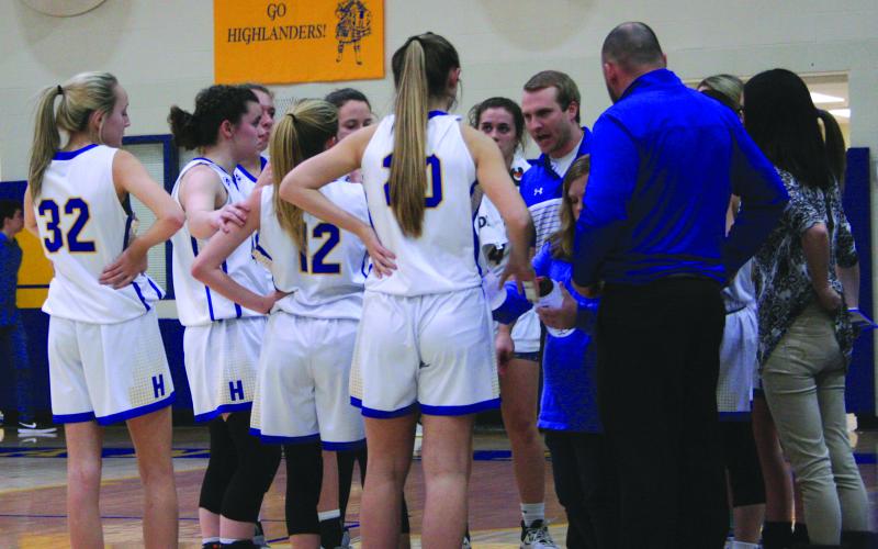 Highlands coach Jacob Page talks to his team during a timeout.