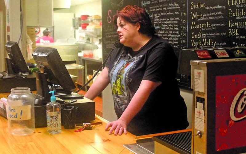 Lydia Hitchcock with The Pizza Place in Highlands is open for business serving carryout meals to residents.