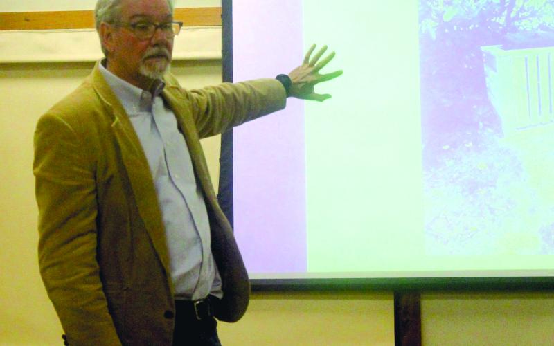 Mayor Patrick Taylor discusses the town budget during his community coffee program at Hudson Library on Friday.