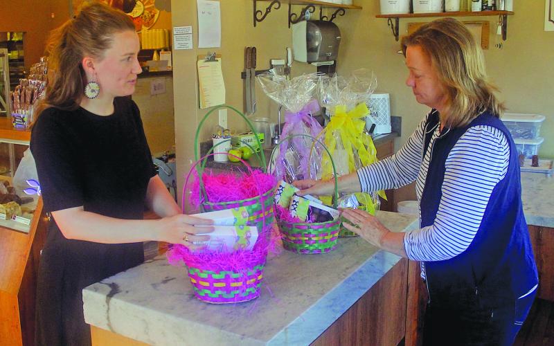 Kilwin's owner Ashley Clark and her mother Tallulah Adams pack baskets for their Easter basket sale this spring.