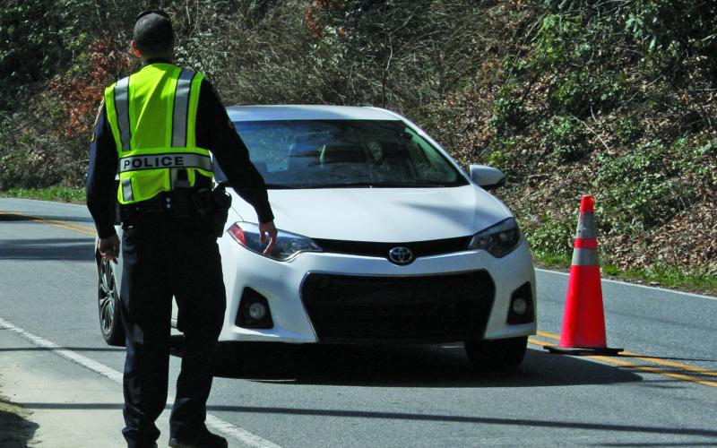 Highlands police officers are no longer manning checkpoints, but are continuing to enforce rules related to COVID-19.