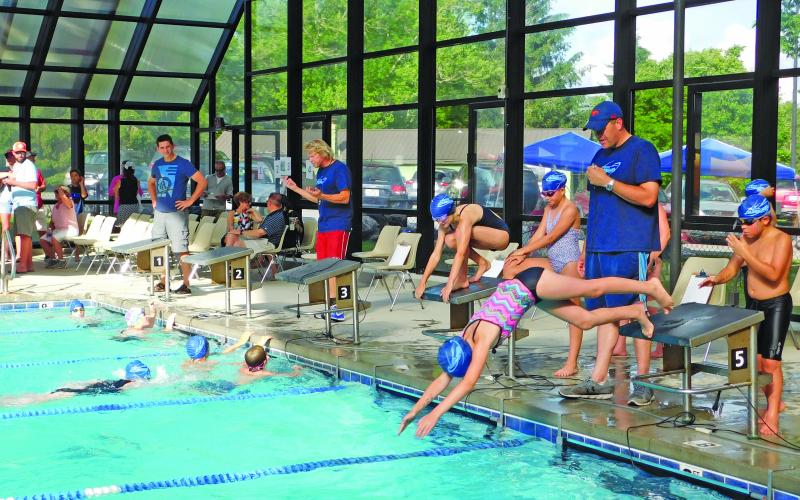 The rec center pool reopening could mean a return to practice for the Highlands Hurricanes swim team.