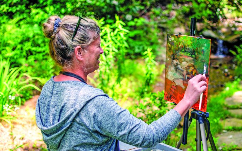 Madeline Dukes, a featured artist from Charleston, South Carolina, took advantage of perfect weather and beautiful scenery during the Cashiers Plein Air Festival held on July 15-19 at The Village Green.