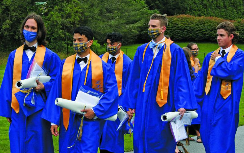 The Highlands School class of 2020 tossed their caps along the track, instead of inside the gymnasium, during Saturday’s graduation ceremony.