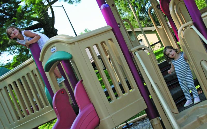 Juliette Norman and Frances Clark were caught having a good time on the playground at the Highlands Rec Park on Monday.