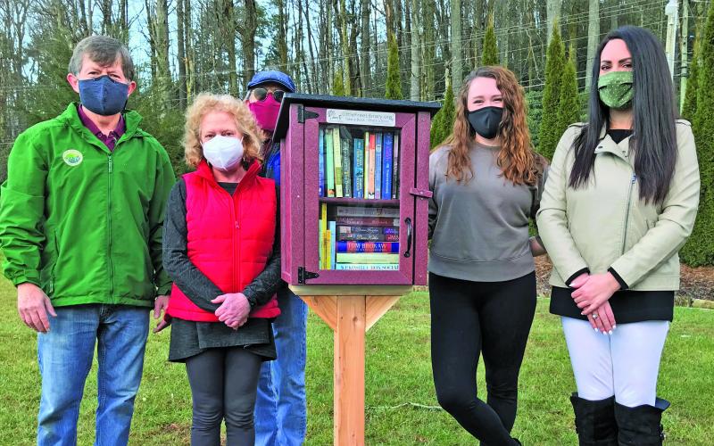 Pictured with the most recent Little Free Library installation are Andy Chmar, Hudson Library of Highlands board president, Helene Siegel, Hudson Library trustee, Ricky Siegel, Little Free Library steward,  Jenni Edwards, marketing manager for The Literacy and Learning Center and Bonnie Potts, executive director of The Literacy and Learning Center.