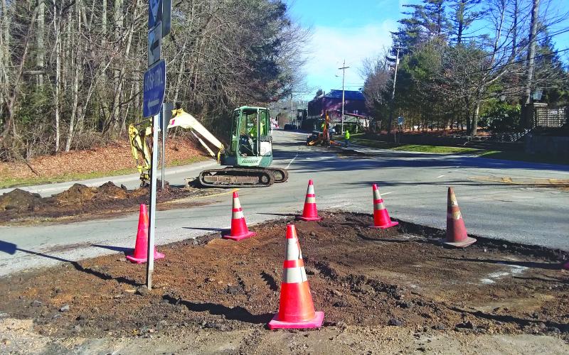 Crews work to remove cement dividers from the intersection of NC 28 and Satulah Road. The area is scheduled to be resurfaced as part of a larger project covering Main Street and US 64 in Highlands.