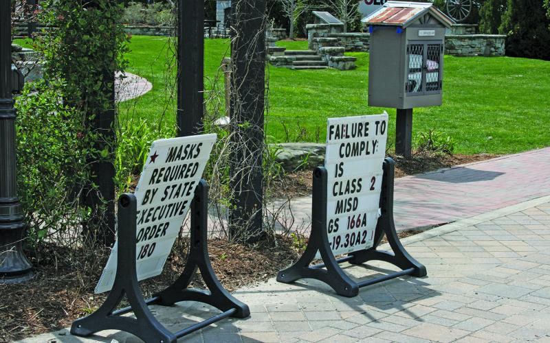 Informational signs regarding the Town of Highlands mask mandate are back in place at Kelsey-Hutchinson Founders Park.