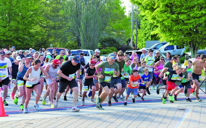 A group of 237 runners took off from the starting line at Kelsey-Hutchinson Founders Park for the annual Twilight 5K and 10K on Saturday night.