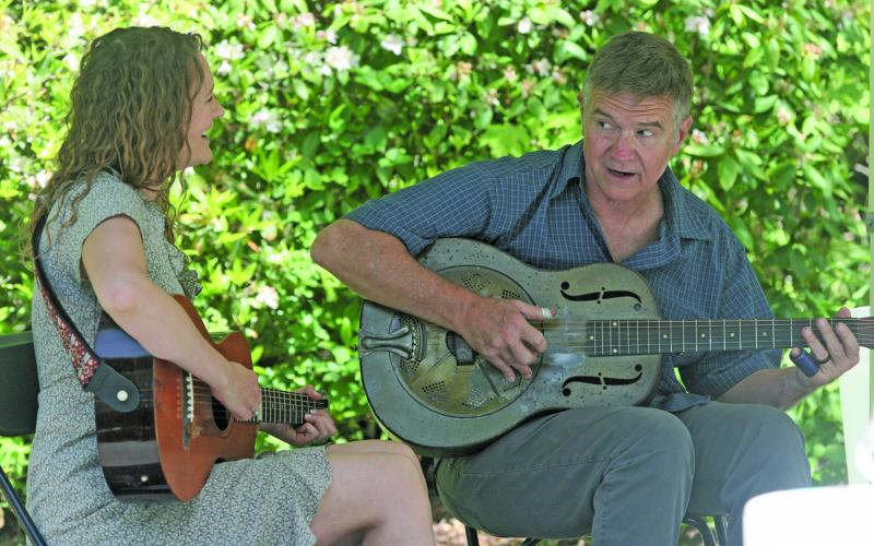 Frank and Allie play outside Hudson Library during the first ever Meander in May on Saturday afternoon.