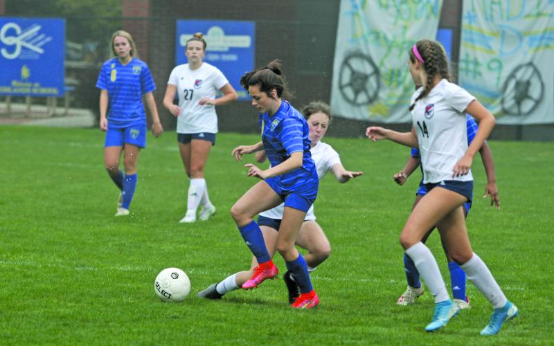 Highlands forward Reese Schmitt strides past a Lincoln Charter defender during the first half of their NC High School Athletic Association 1-A state playoff game on Monday night.