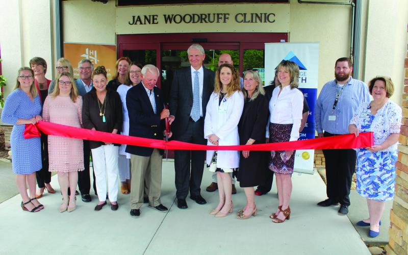 Photo by Michael Ohearn/Crossroads Chronicle    Dr. Walter Clark, Dr. Richard Hudspeth, BRH Staff, HCHF Board and staff cut the ribbon to the Blue Ridge Health Clinic.