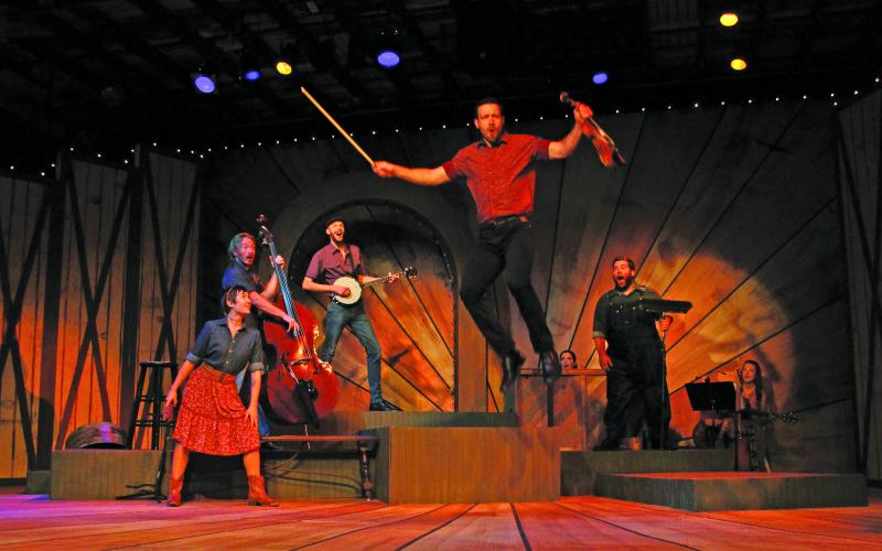 Photo by Christopher Smith/Staff Andrew Fehrenbacher (Jason) jumps off of a platform as Bailey Baker (Trenna,) Andrew Harvey (Eddie,)  Jimmy Lewis (Mark) and James Rowell IV (David) watch in awe.