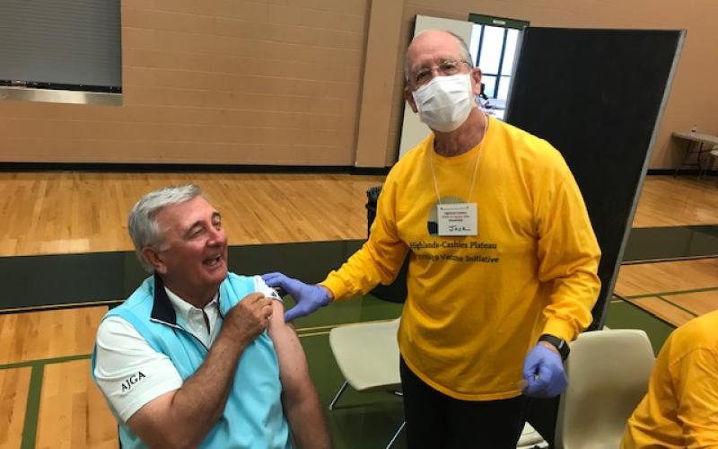 Chris Byrd was happy to receive his booster Covid vaccine shot, thanks to Jack Appel one of the many volunteers.
