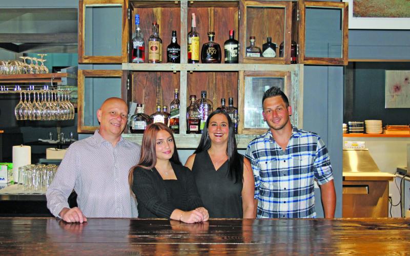 Photo by Christopher Smith/Staff David, Magnolia and Jennifer Cunningham with Zack Hedden.