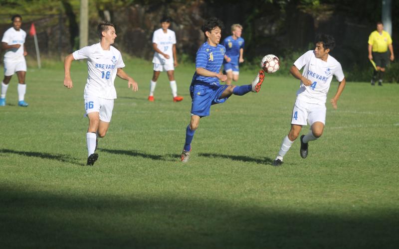 Photo by Christopher Smith/staff Ronaldo Factor tries to bring the ball down against Brevard, Thursday night.