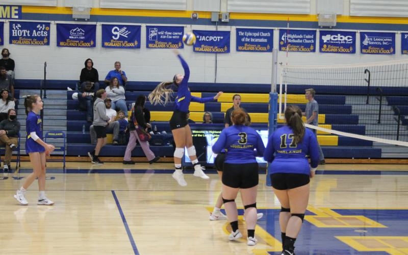 Photo by Christopher Smith/Staff Ava Schmitt goes up for a kill against Nantahala.