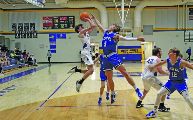 Photo by Christopher Lugo/Staff HHS junior Kaden Mitchell goes up for a shot against Towns County, Friday night.