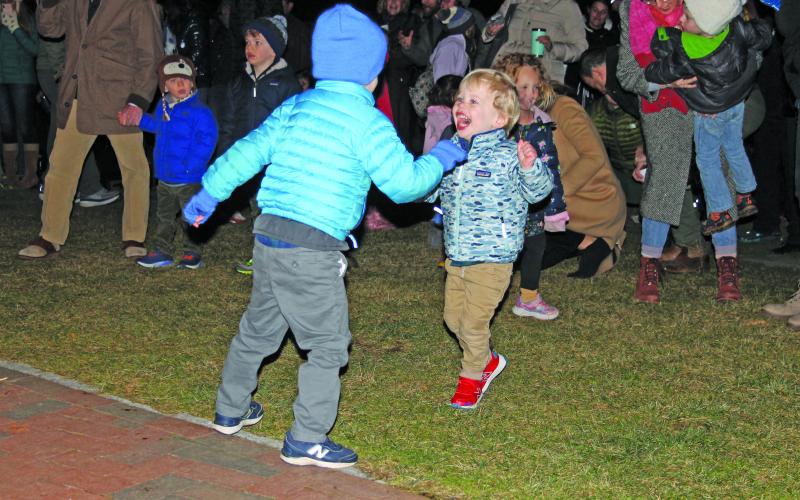 Children dancing in the park.