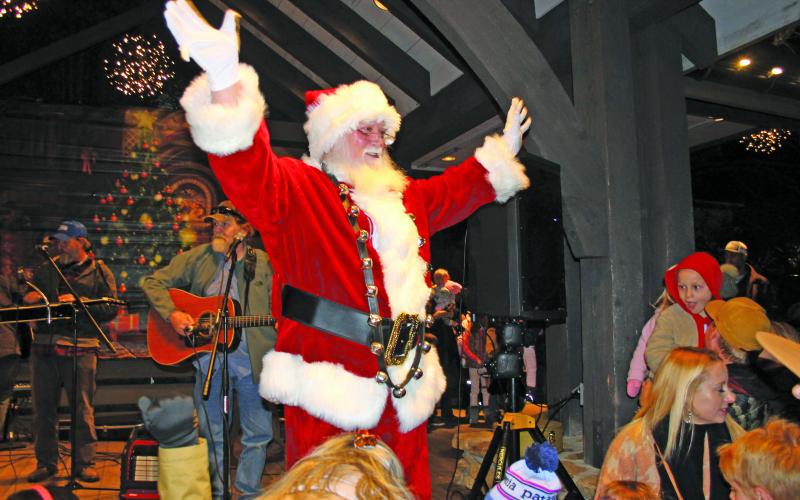 Santa Claus greeting the crowd.