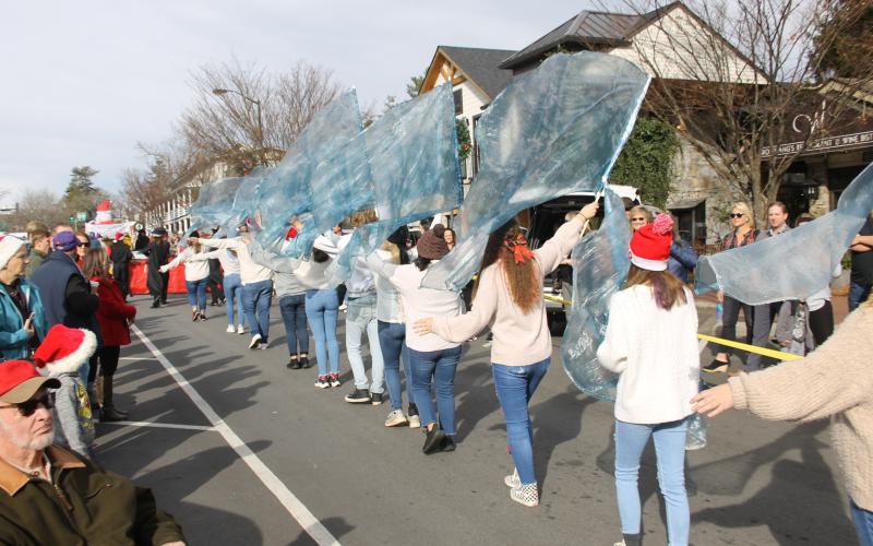 Photo by Christopher Lugo/Staff The Franklin High School marching band colorguard marched in the parade.