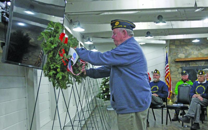 Photo by Christopher Lugo/Staff P.J. Pugh places a wreath in honor of the U.S. Marines Corp.