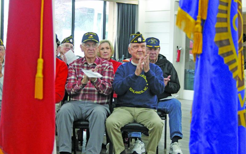 Photo by Christopher Lugo/Staff Leonard Parks and Bill Reese applaud during the Wreaths Across America ceremony.