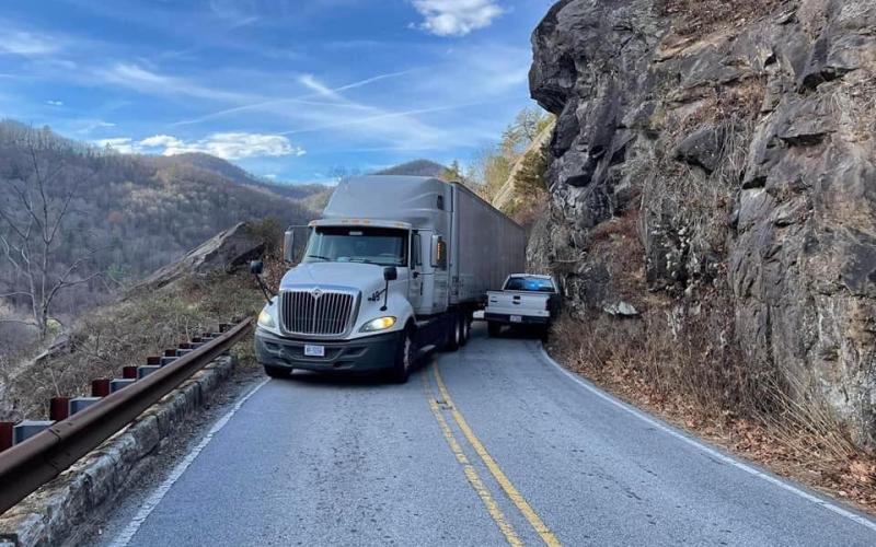 Submitted Photo A pick up truck tries to squeeze past a tractor trailer in the Cullasaja Gorge in December.