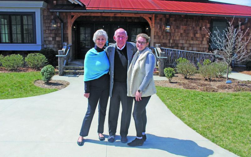 Photo by Michael O’Hearn/Crossroads Chronicle Village Green executive director Ashlie Mitchell-Lanning with Bill and Sue Lewis.