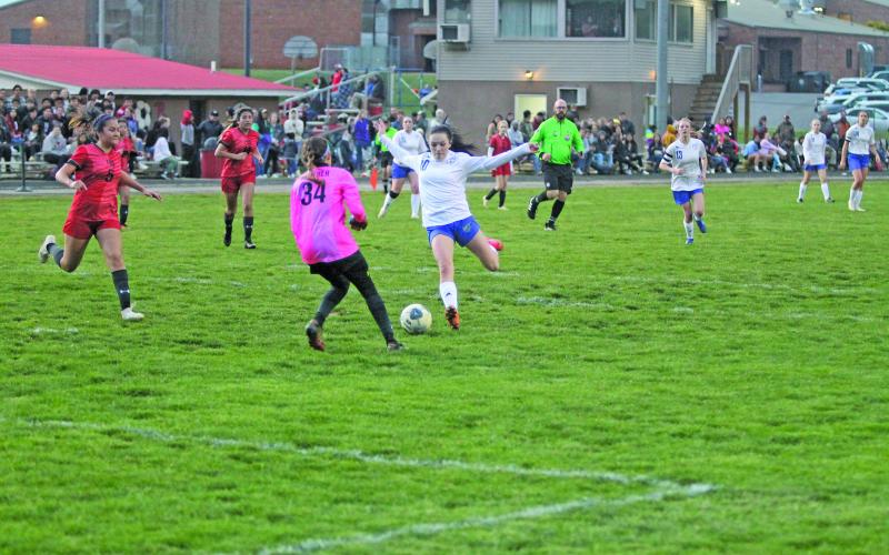 Photo by Christopher Lugo/Staff Highlands senior Reese Schmitt leans back for a shot against Franklin Friday night. Schmitt had two goals on the night.