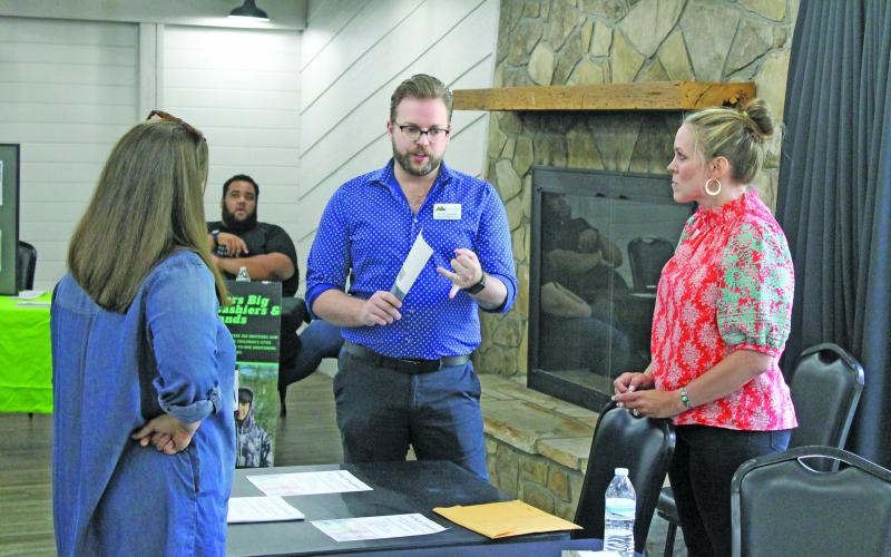Photo by Christopher Lugo/Staff Mountain Theatre Company director Scott Daniels speaks with Marci Sherwood from the Highlands Chamber of Commerce during the first ever Highlands Volunteer Fair.