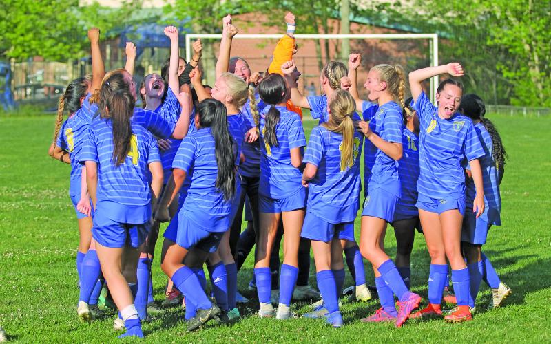 Photo by Christopher Lugo/Staff The Lady Highlanders break it down after their historic win against Elkin, Thursday night.