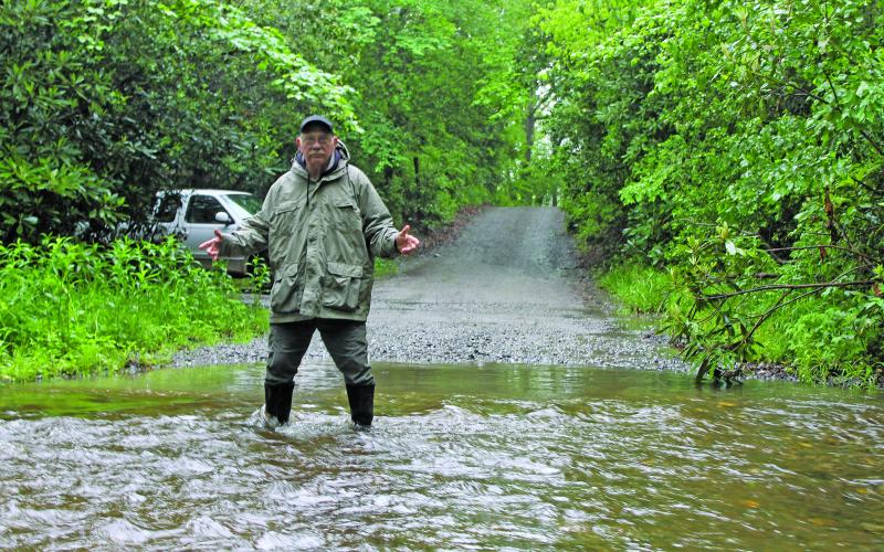 Photo by Christopher Lugo/Staff There is a creek that runs through Hickory Knut Gap Road that sometimes floods to almost two feet deep. Residents like Duncan Greenlee have to drive through the creek daily.